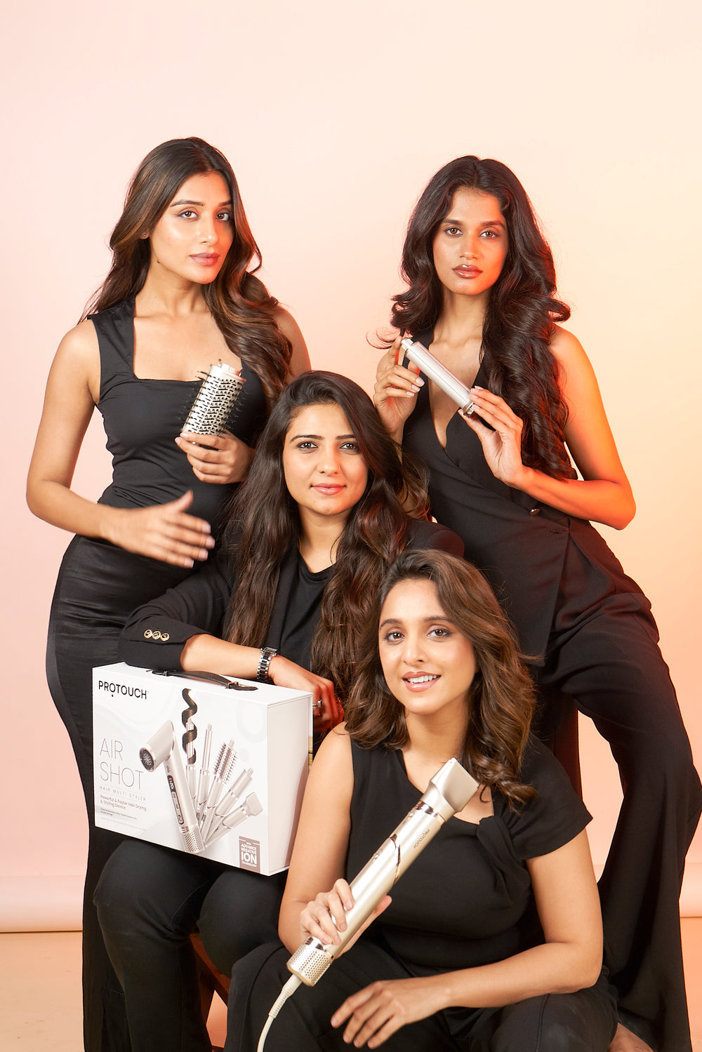 Woman holding a Protouch hair styling tool